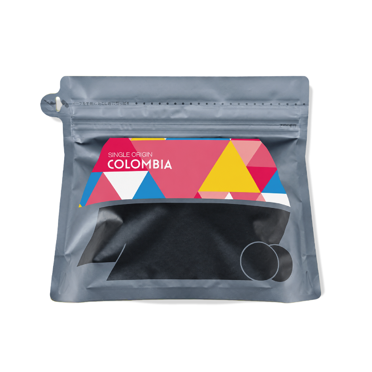 hugcoffeeのコロンビア エルディビソ ピンクブルボン100g。ピンクのラベルが付いた黒いコーヒー豆の袋。
