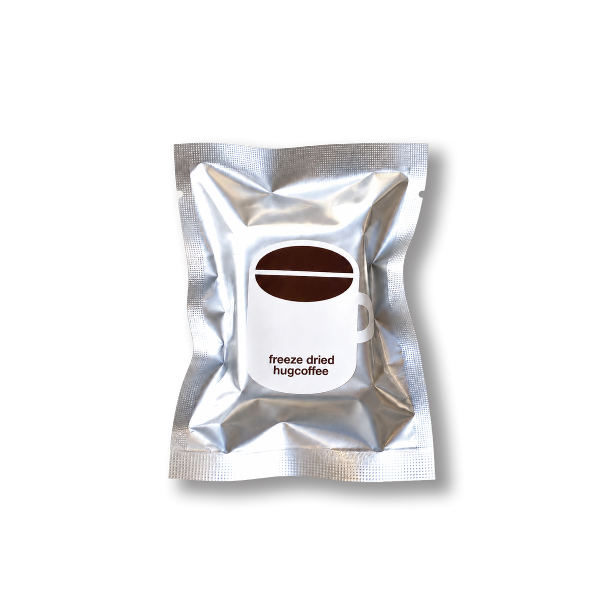 hugcoffeeのフリーズドライコーヒー。コーヒーカップのイラストが付いた銀色の袋。