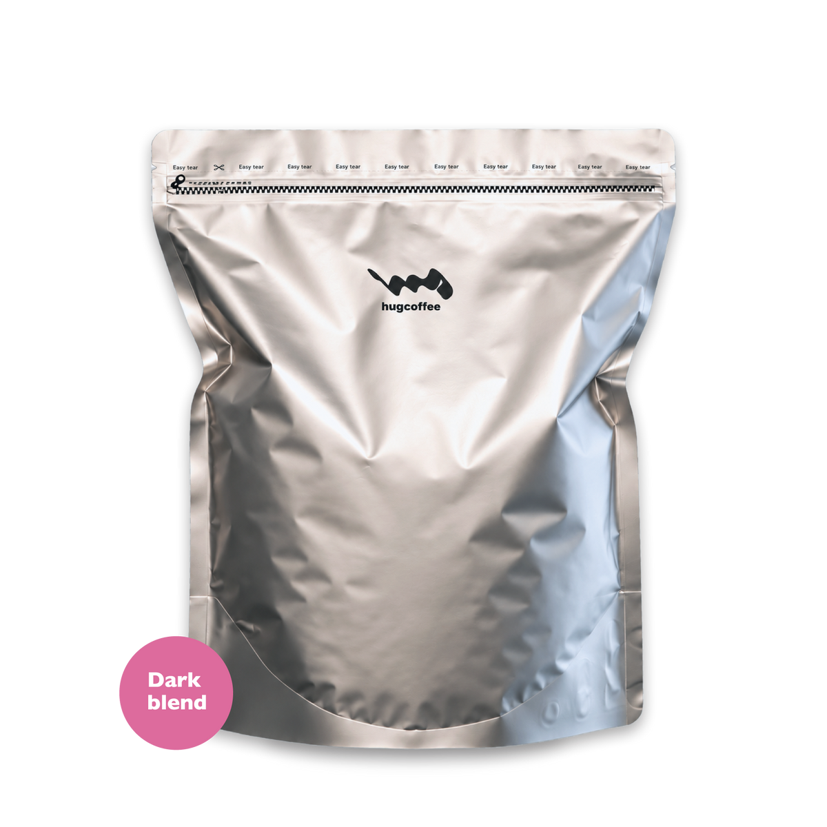 hugcoffeeのダークブレンド1kg。銀色のコーヒー豆の袋にピンクの丸いラベル。